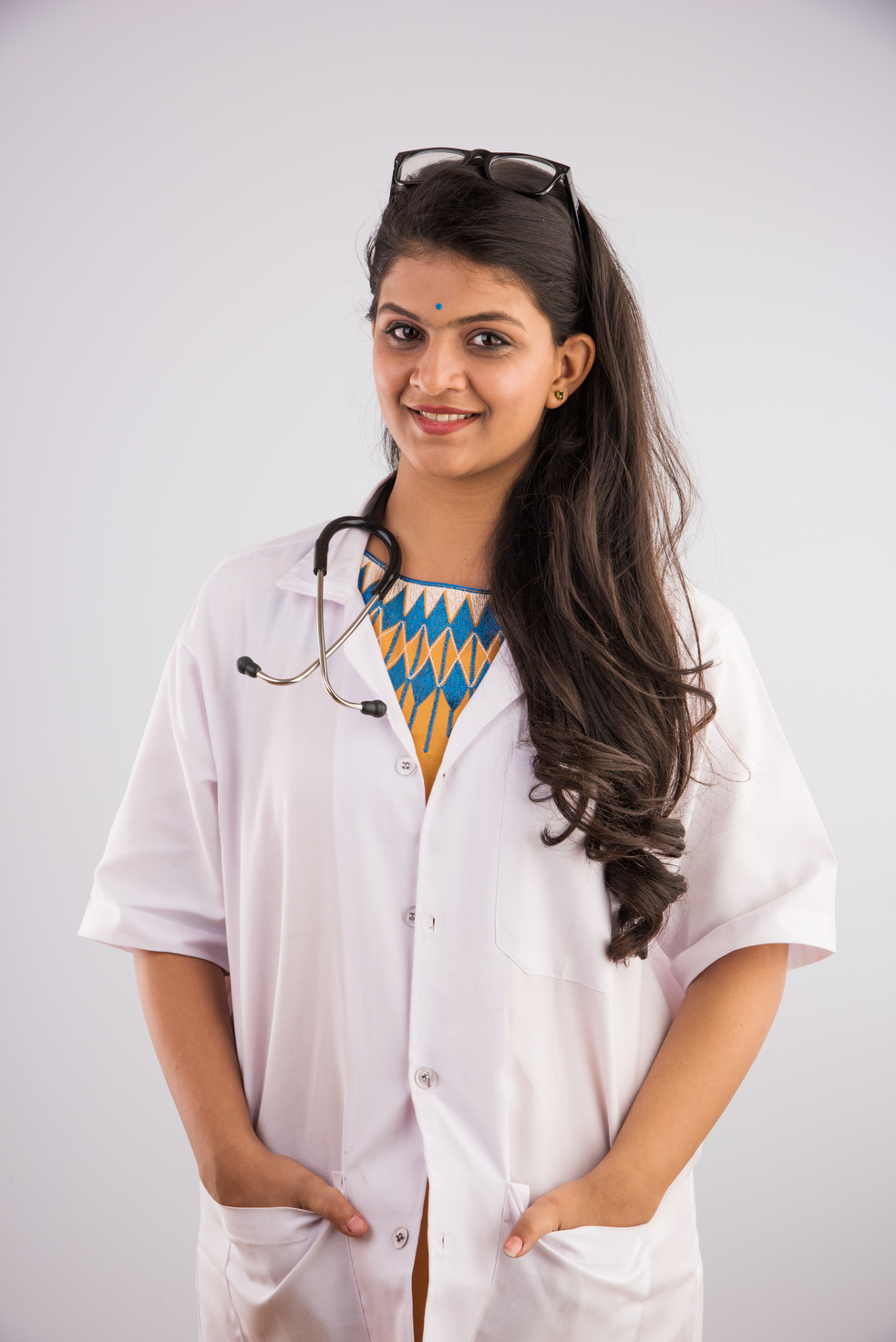 indian female doctor standing, happy indian doctor